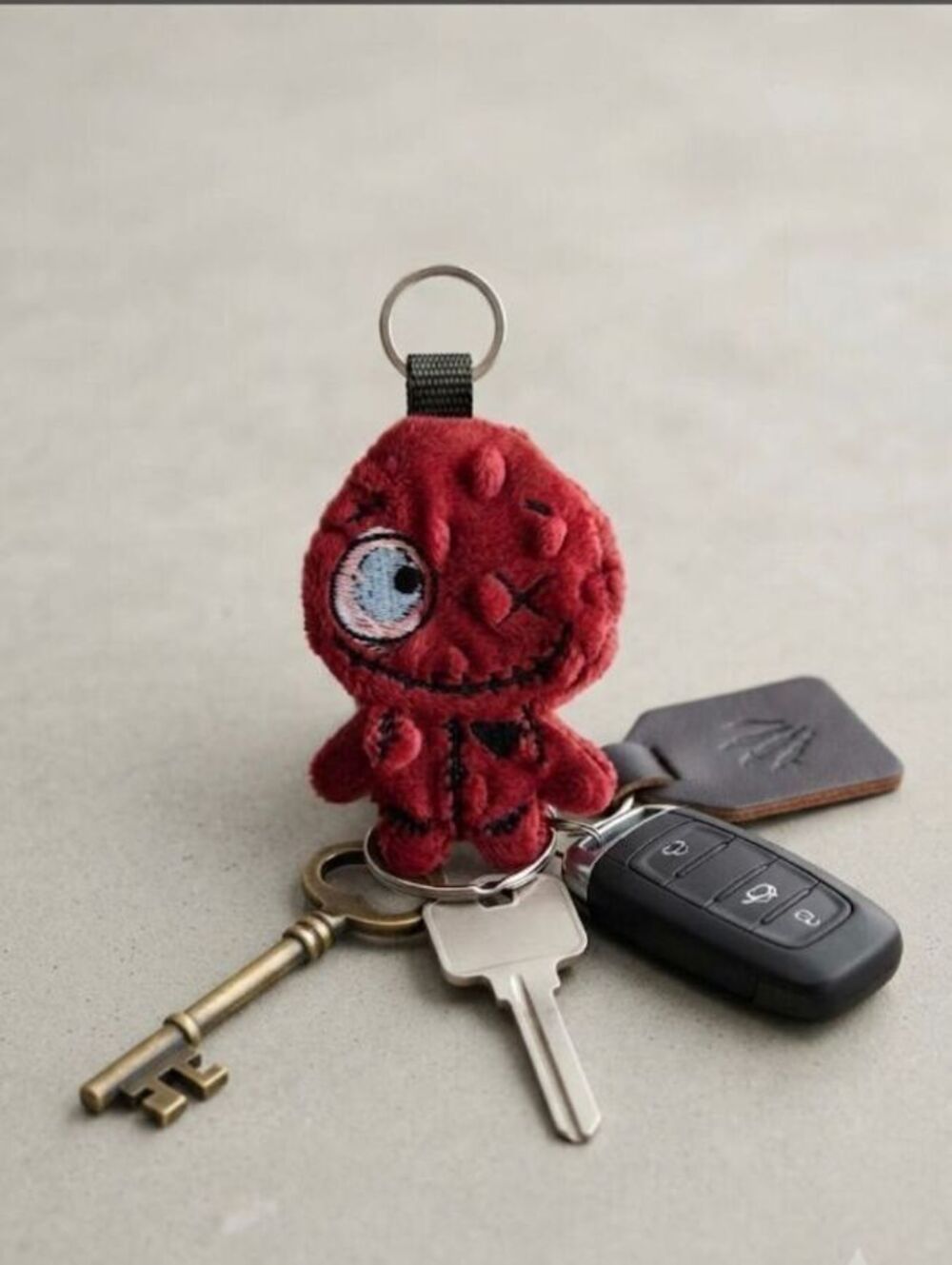 Red Plush Monster Keychain with Embroidered Details and Metal Ring